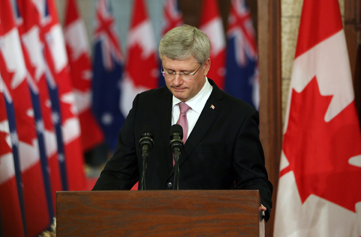 Canadian Prime Minister Stephen Harper pauses as he address the media alongside Australian Prime Minister Tony Abbott(not shown) on Parliament Hill in Ottawa, Canda, June 9, 2014. 