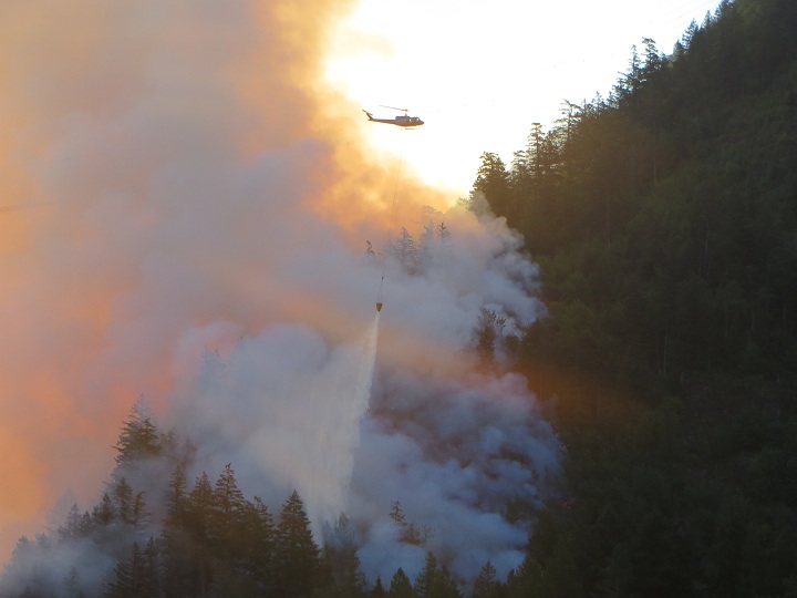 Helicopter crews fight the fire near Harrison Hot Springs.
