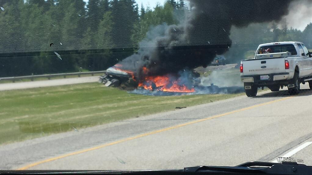Vehicle on fire just west of Edmonton on Highway 16; July 3, 2014.