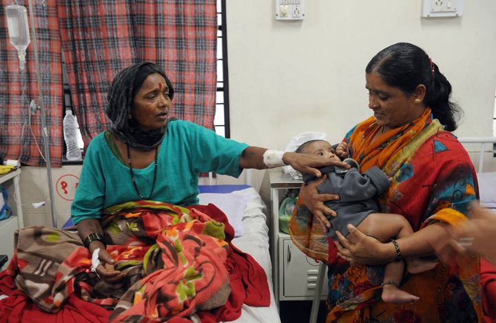 Indian survivors of the landslide at Malin village in Pune district in the western state of Maharashtra recuperate at a government hospital in Manchar on July 31, 2014.