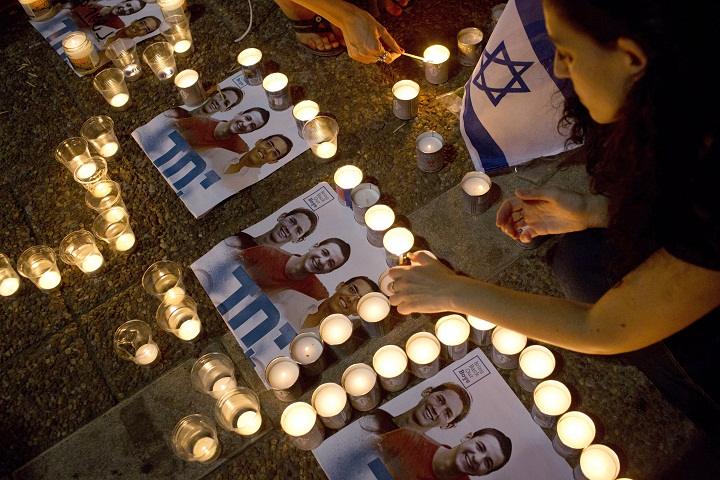 Israelis mourns and light candles in Rabin Square in Tel Aviv on June 30, 2014.