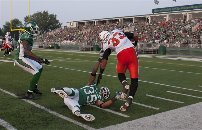 B.C. Lions running back Andrew Harris runs in a touchdown after he breaks a tackle from Saskatchewan Roughriders linebacker Weldon Brown during the first quarter of CFL football action in Regina, Sask., Saturday, July 12, 2014.
