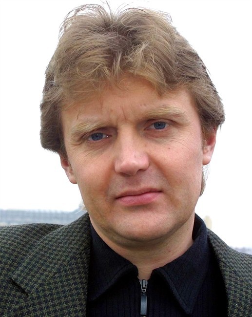 FILE - In this Friday, May 10, 2002 file photo Alexander Litvinenko, former KGB spy and author of the book "Blowing Up Russia: Terror From Within", is photographed at his home in London.