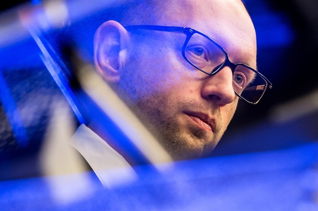 In this Thursday, March 6, 2014 file photo, Ukraine's Prime Minister Arseniy Yatsenyuk attends a news conference at an EU summit in Brussels. 