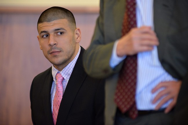 Aaron Hernandez looks on during proceedings in Fall River superior court Monday July 7, 2014, in Fall River, Mass. The Judge agreed that Hernandez could be moved to a jail closer to Boston while he awaits his trial for the murder of Odin Lloyd. (AP Photo/The Boston Globe, Josh Reynolds, Pool).