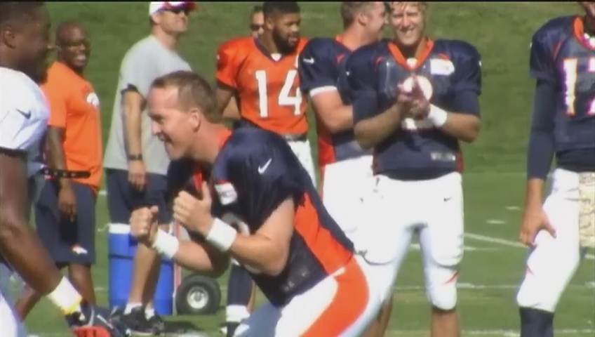 Denver Broncos QB Peyton Manning flashes dance moves, plays with his kids  at practice