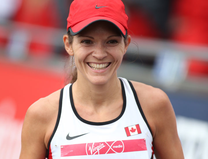 Canada's Lanni Marchant smiles after finishing 4th in the Women's Marathon race during the Commonwealth Games Glasgow 2014, Scotland, Sunday July 27, 2014. 