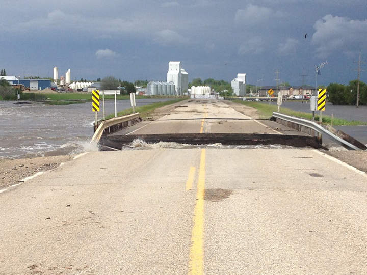 The Highway 83 bridge west of Melita, Man., was washed out by floodwater on Canada Day.