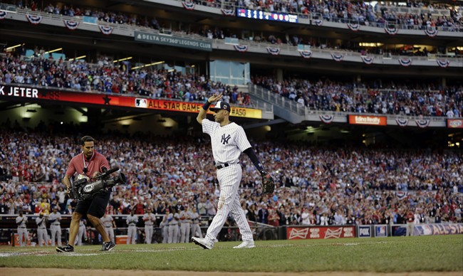 American League shortstop Derek Jeter, of the New York Yankees, waves as he is taken out of the game in the top of the fourth inning of the MLB All-Star baseball game, Tuesday, July 15, 2014, in Minneapolis.