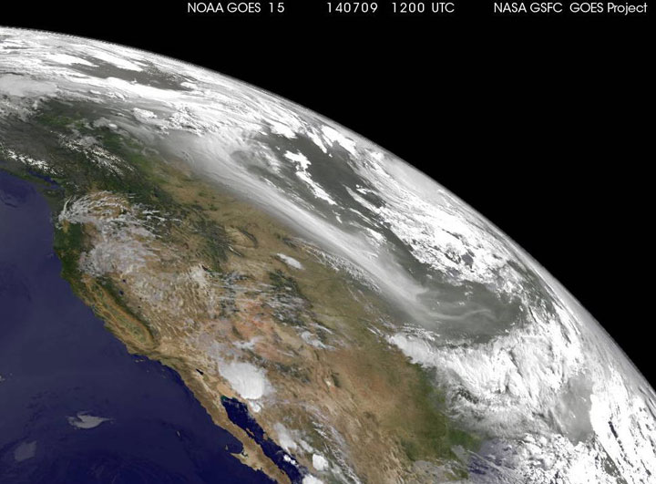 A satellite image shows fires from the Northwest Territories drifting south over Canada and the United States.