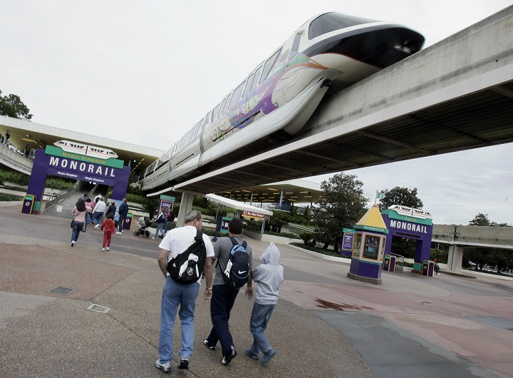 File: Visitors to Walt Disney World walk toward the Mono Rail train station 25 January 2007 in Lake Buena Vista, Florida. 