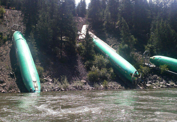 This Sunday, July 6, 2014 photo shows a freight train that derailed near Alberton in western Montana on Thursday, July 3. 