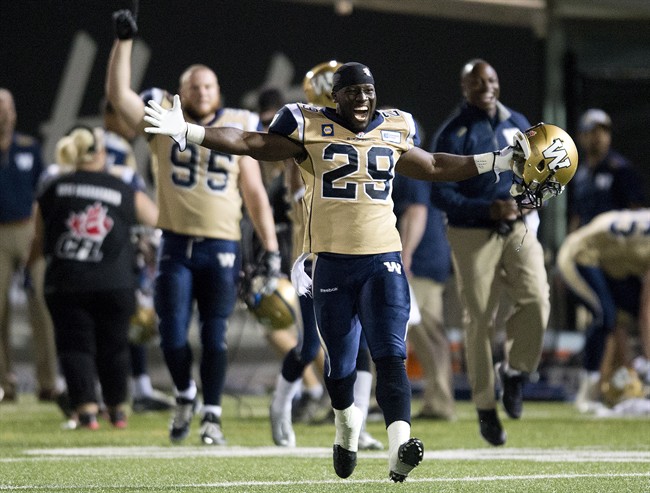 Winnipeg Blue Bombers running back Carl Volny (29) celebrates after defeating the Hamilton Tiger-Cats during second half CFL football action in Hamilton, Ont., on Thursday, July 31, 2014.