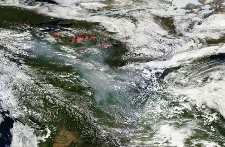 A satellite image captures smoke from fires in the Northwest Territories as it descends across Canada and the United States on July 9, 2014.