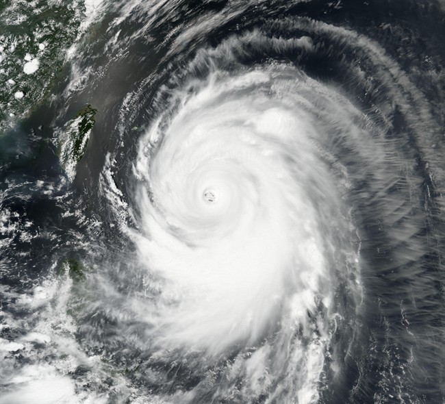 In this image provided by NASA, Typhoon Neoguri churns toward Okinawa and southern Japan on Tuesday, July 8, 2014.