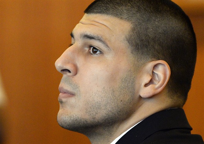 Former NFL football player Aaron Hernandez watches during a hearing in Bristol County Superior Court Tuesday, July 22, 2014, in Fall River, Mass. 