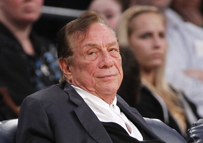In this Dec. 19, 2011 file photo, Los Angeles Clippers owner Donald Sterling watches the Clippers play the Los Angeles Lakers during an NBA preseason basketball game in Los Angeles.