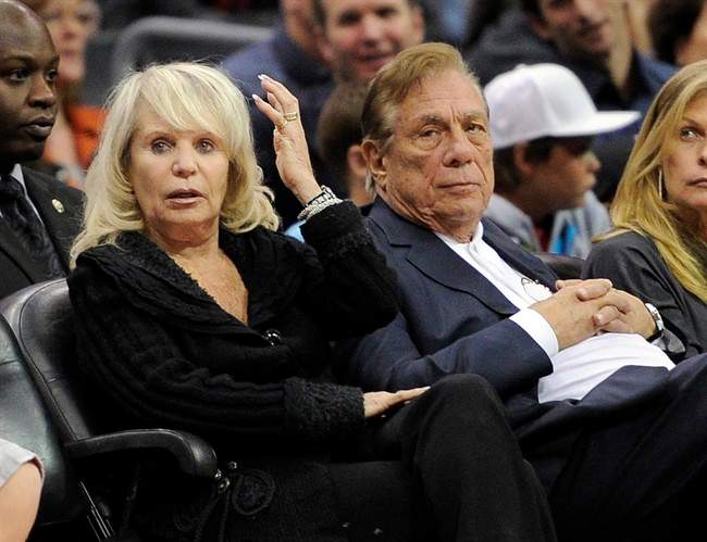 In this Nov. 12, 2010, file photo, Shelly Sterling sits with her husband, Donald Sterling, right, during the Los Angeles Clippers' NBA basketball game against the Detroit Pistons in Los Angeles. 