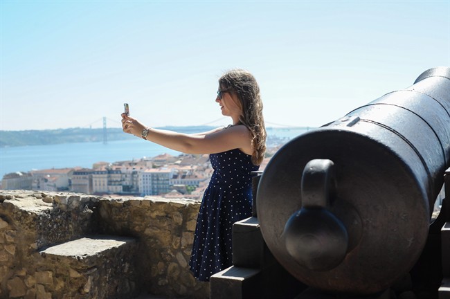 This June 2013 photo shows Abigail Austin taking a selfie on a trip to Lisbon, Portugal, when she was 17. 