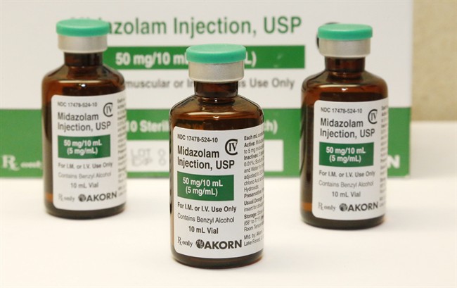 This Friday, July 25, 2014 photo shows bottles of the sedative midazolam at a hospital pharmacy in Oklahoma City. 