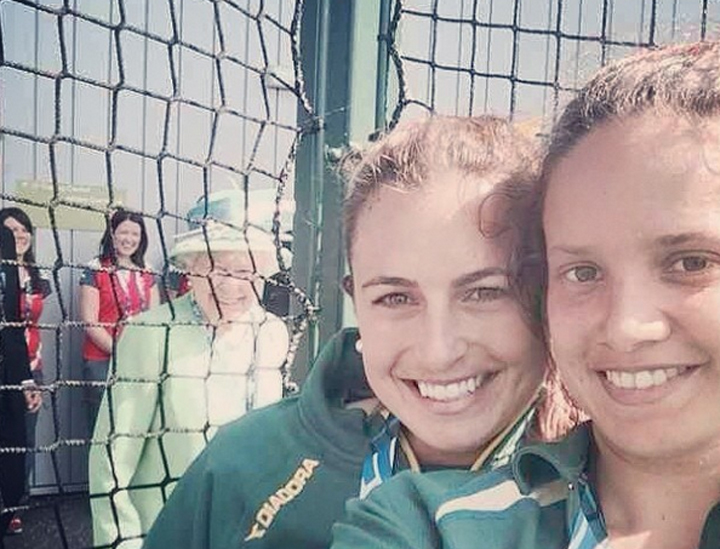 Queen Elizabeth II photobombed a pair of Australian field hockey players at the Commonwealth Games in Glasgow, Scotland.