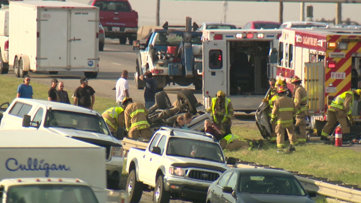 Emergency crews rush to the scene of a rollover on southbound Deerfoot Trail on Tuesday, July 15th, 2014. 