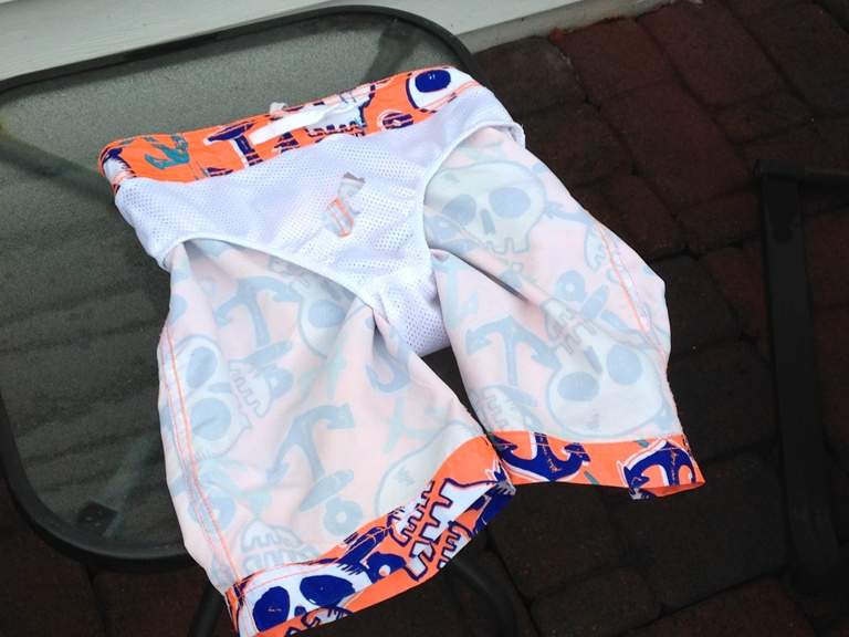 The hole that was cut to free Ronan from his swimming trunks can be seen.