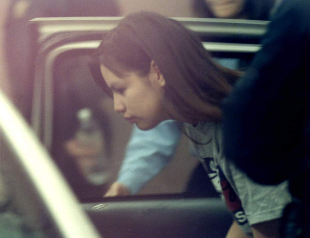 Serena Nicotine gets into a police vehicle in Saskatoon, Sask. Monday, March 8, 1999.
