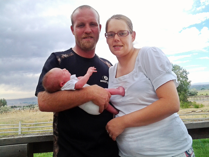 This photo provided by Shawna Uriguen, shows Shawna with her fiancé Clay Crown, left, and their daughter Kimber Marie Crown taken in Buhl, Idaho on Wednesday, July 2, 2014. 