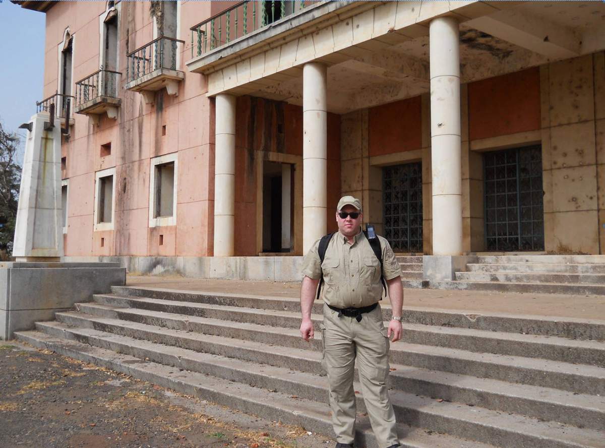 Snowdy in Guinea-Bissau in 2010 outside the presidential palace where Joao Bernardo Vieira was killed. (Handout/Derrick Snowdy)