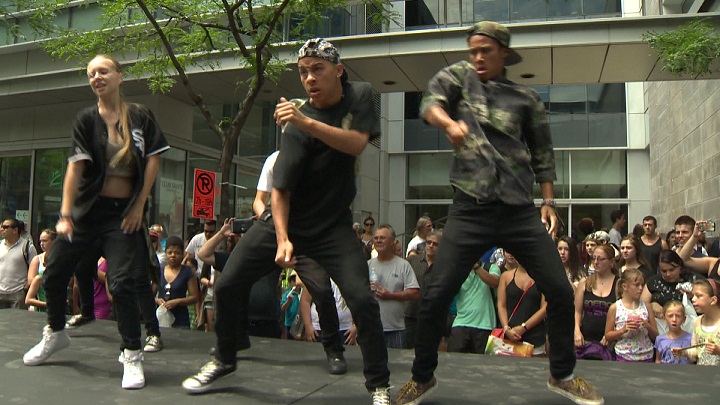 Dancers entertain the crowds in downtown Montreal, July 12, 2014.