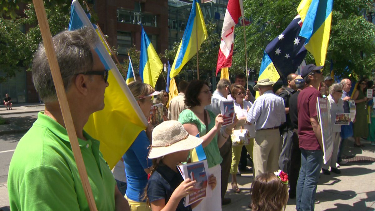 Protesters gather outside the French consulate in Montreal.