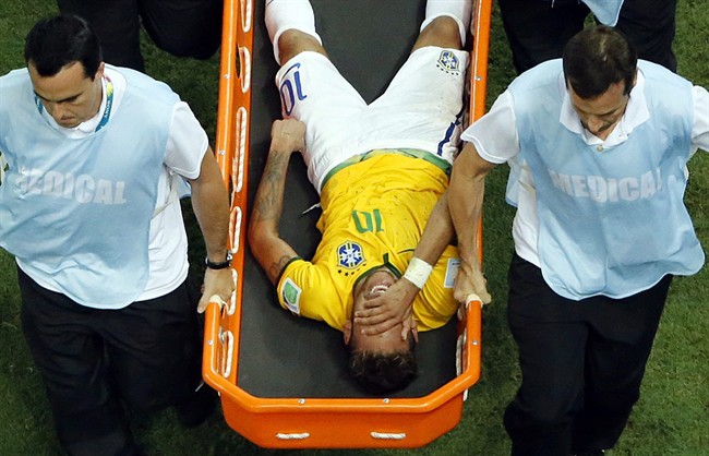 Brazil's Neymar is carried away on a stretcher during the World Cup quarterfinal soccer match between Brazil and Colombia at the Arena Castelao in Fortaleza, Brazil, Friday, July 4, 2014.