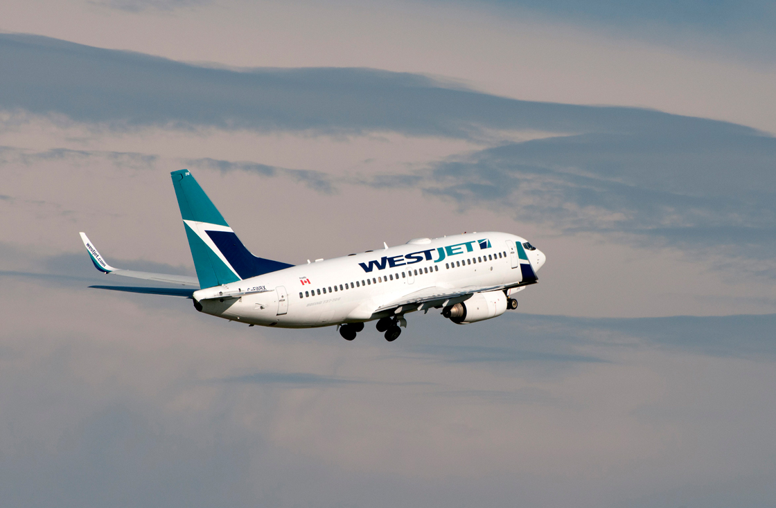 A WestJet Airlines Boeing 737 (737-700) jetliner takes off at Calgary, Alberta on July 19, 2013. THE CANADIAN PRESS IMAGES/Larry MacDougal