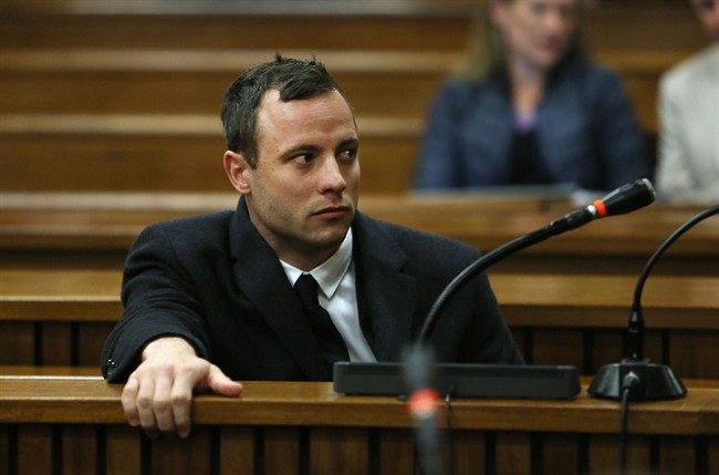 Oscar Pistorius attends court at his murder trial for the shooting death of his girlfriend Reeva Steenkamp on St. Valentine's Day 2013 in Pretoria, South Africa, Tuesday, July 8, 2014.