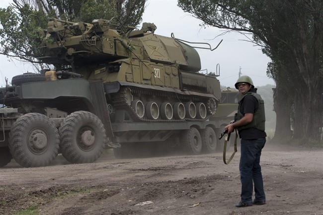 Ukrainian government forces manoeuvre antiaircraft missile launchers as they are transported north-west from Slavyansk, eastern Ukraine Friday, July 4, 2014. 