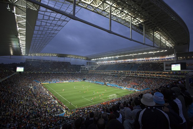 Soccer fans watch the World Cup semifinal match between the Netherlands and Argentina in the Itaquerao Stadium, in Sao Paulo Brazil, Wednesday, July 9, 2014. The match remained scoreless at haltime (AP Photo/Felipe Dana).