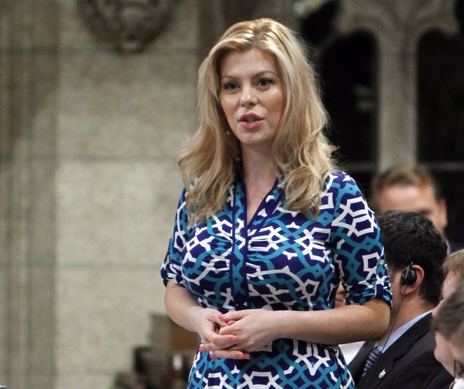 Eve Adams, Conservative MP and Parliamentary Secretary to the Minister of Health, stands in the House of Commons during question period Friday May 30, 2014. Adams, who has been in a heated nomination battle in the new Toronto-area riding of Oakville North-Burlington, says she is dropping out for health reasons.THE CANADIAN PRESS/Fred Chartrand.