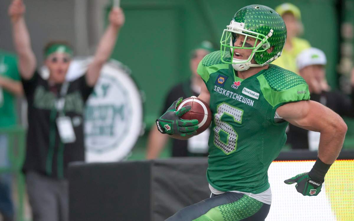 Saskatchewan Roughriders wide receiver Rob Bagg celebrates with fans after scoring a touchdown against the Montreal Alouettes during the fourth quarter of CFL football action on Saturday, August 16, 2014 in Regina.