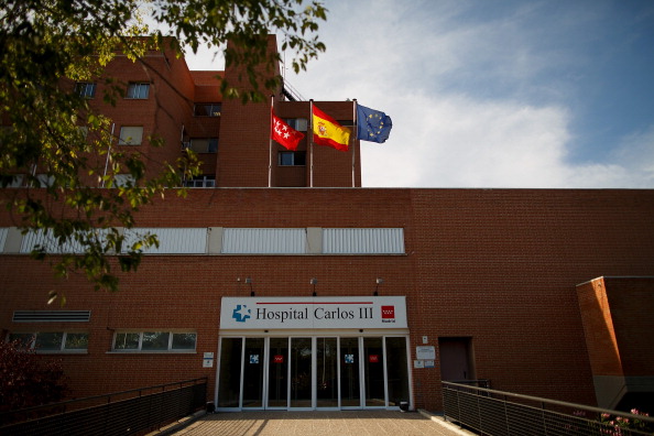 Madrid regional, Spanish and European flags fly on the roof at Carlos III Hospital before the arrival of Priest Miguel Pajares on August 6, 2014 in Madrid, Spain.