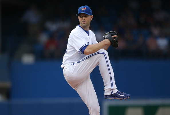  J.A. Happ #48 of the Toronto Blue Jays delivers a pitch in the first inning during MLB game action against the Baltimore Orioles on August 7, 2014 at Rogers Centre in Toronto, Ontario, Canada.  (Photo by Tom Szczerbowski/Getty Images).