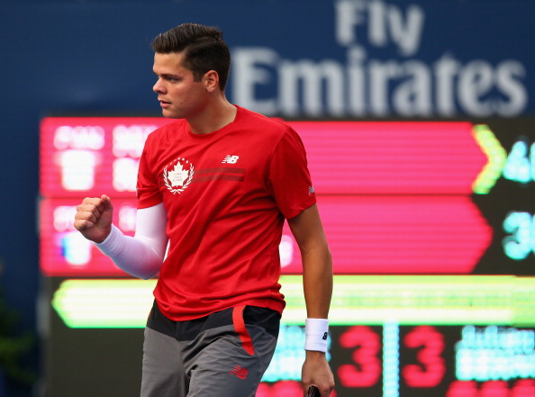 Milos Raonic of Canada reacts after a point with Julien Benneteau of France during Rogers Cup at Rexall Centre at York University on August 7, 2014 in Toronto, Canada.  (Photo by Ronald Martinez/Getty Images).