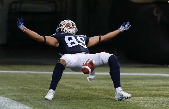 Spencer Watt #89 of the Toronto Argonauts celebrates his 4th quarter touchdown against the Winnipeg Blue Bombers during their game at Rogers Centre on August 12, 2014 in Toronto, Canada. (Photo by Dave Sandford/Getty Images).