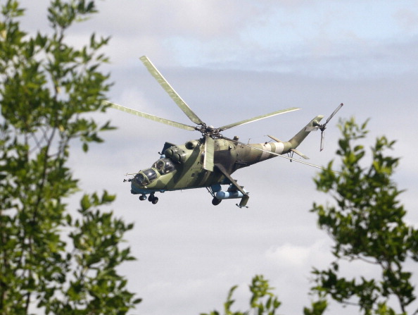 An Ukrainian MI-24 helicopter flies near the eastern Ukrainian city of Kramatorsk on August 19, 2014. Ukraine accused pro-Russian rebels of killing dozens of civilians fleeing the war-torn east on August 18, 2014 as crisis talks between Kiev and Moscow failed to halt months of bloodshed. AFP PHOTO/  ANATOLII STEPANOV.