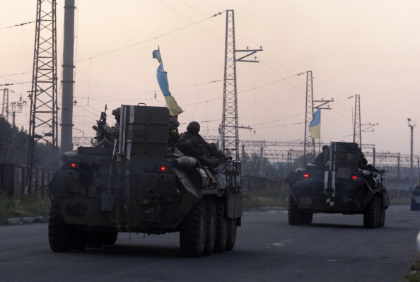 A column of Ukrainian paratroopers rides in Druzhkivka, Donetsk region on April 19, 2014. 