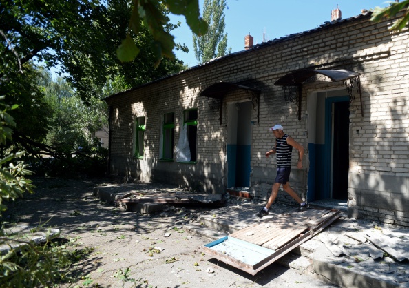 A villager leaves the ward of the hospital hit by a shelling, on August 26, 2014 in Novoazovsk, a village 50 Kms east of Mariupol.