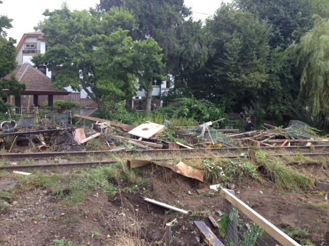 Tearing down the gardens and structures.