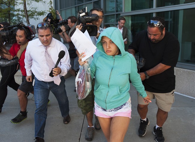Lilia Ratmanski, 25, is released on bail at the Brampton courthouse on Thursday August 28, 2014. A booze-fuelled fight between two women who were allegedly drinking and smoking in an airplane bathroom prompted Sunwing to turn a Cuba-bound flight back to Toronto, the airline said. 