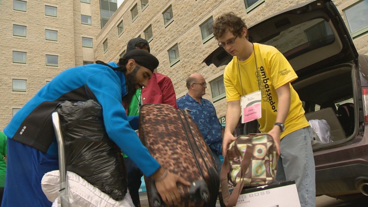 Students help students move into campus housing on Saturday. Over 450 students moved in by the afternoon.