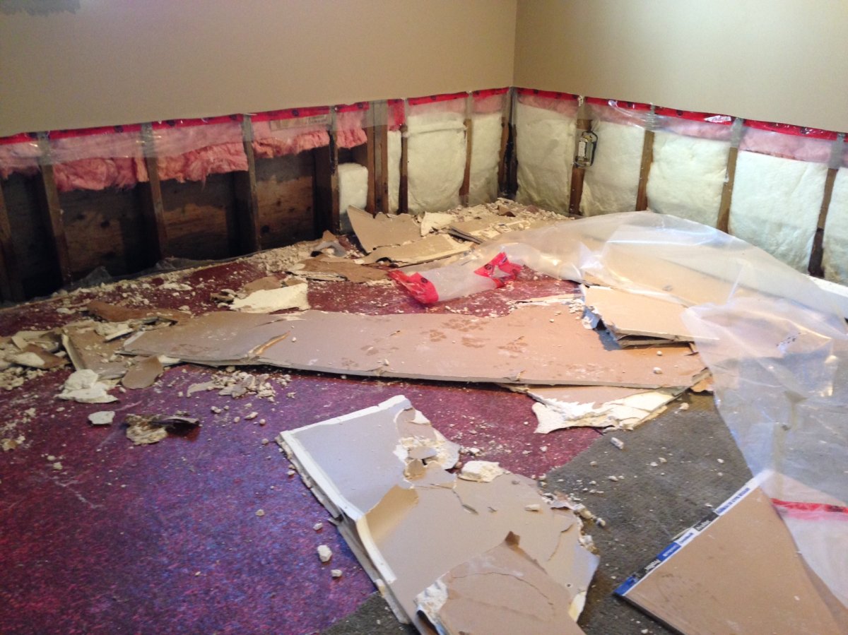 A basement in Steinbach is torn apart after heavy and fast rainfall flooded basement .